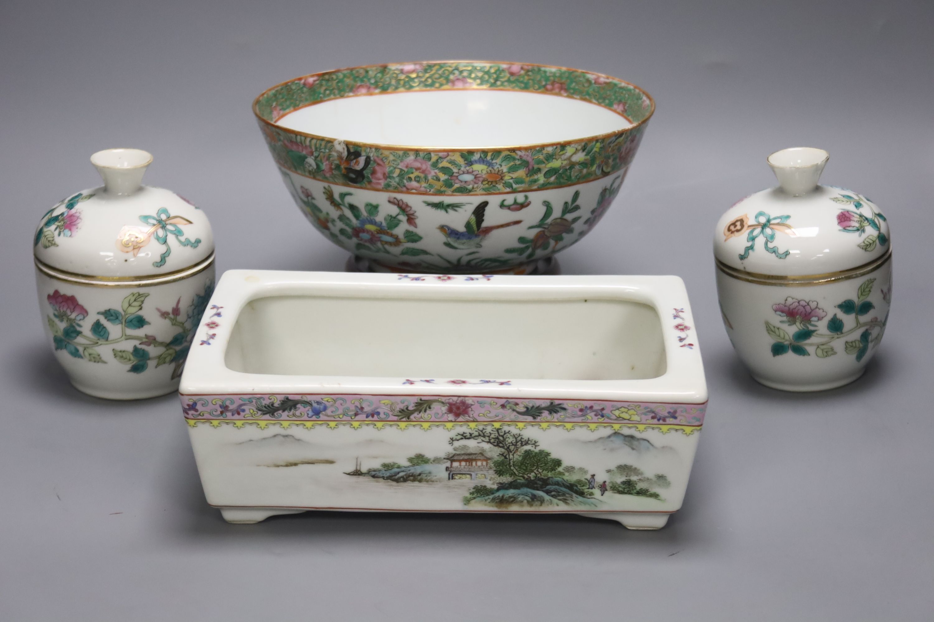 A Chinese circular famille rose bowl, a rectangular landscape-decorated planter and a pair of small bowls and covers, largest 24cm Dia 23cm (bowl)